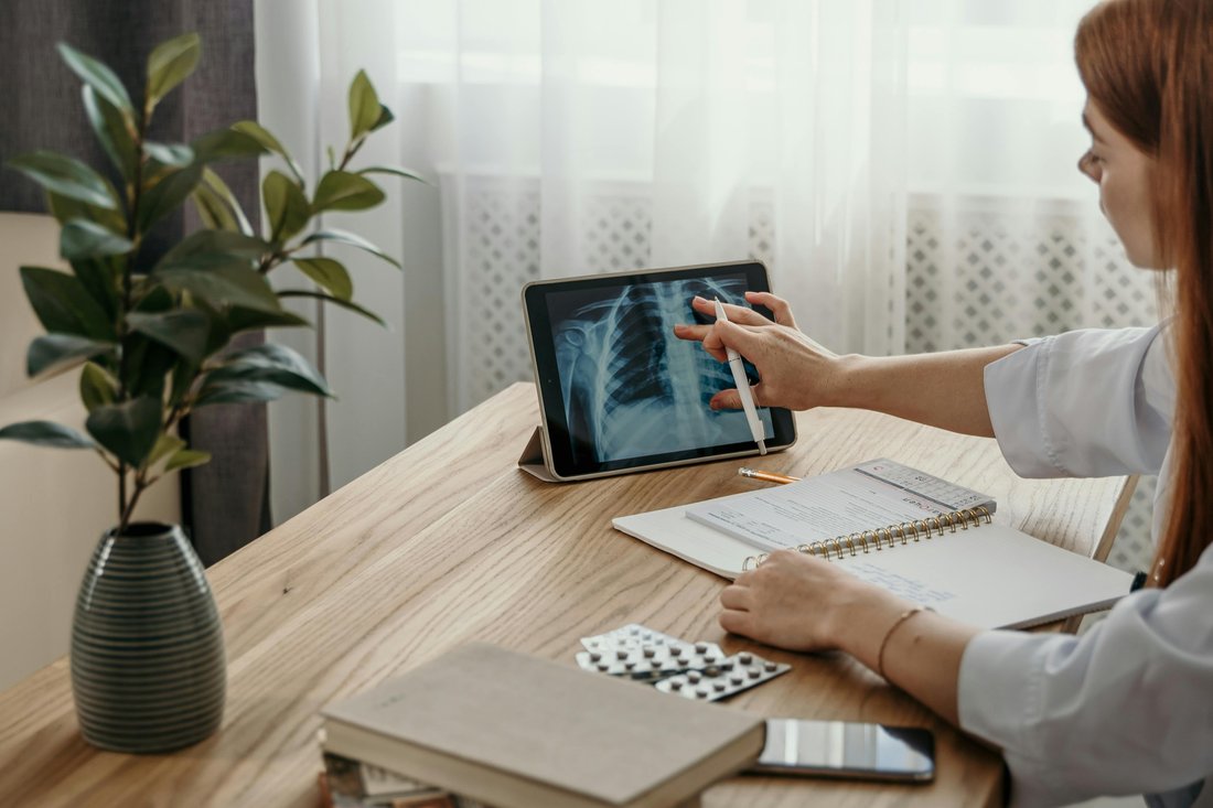 A healthcare provider reviewing clinical information with a patient